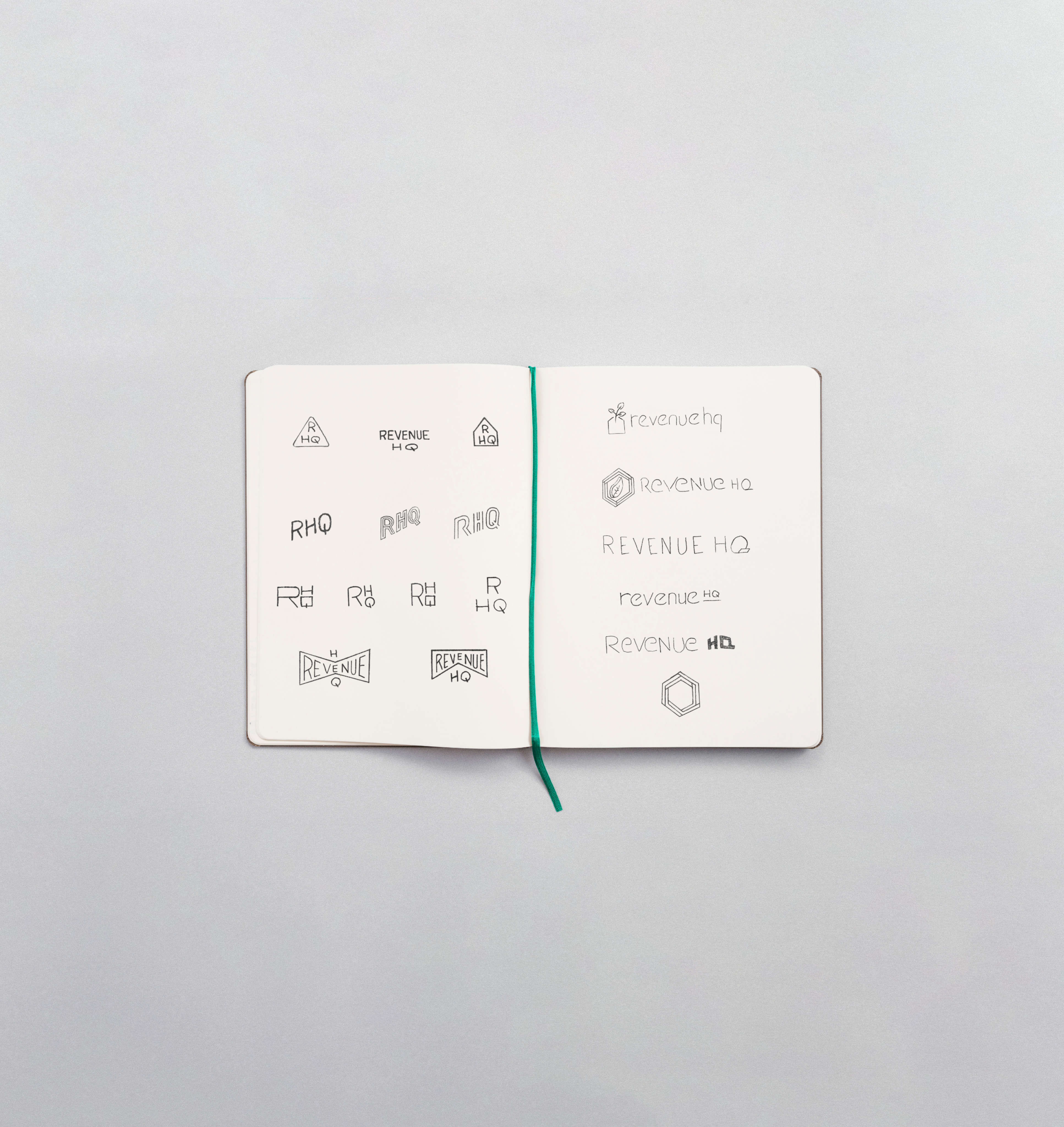 Revenue HQ logo sketches in a sketchbook