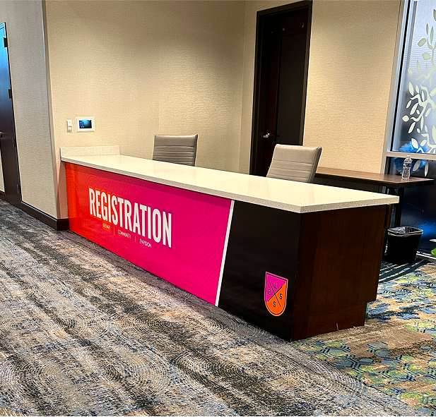 Graphic depicting a hexagonal cropped photo of an interior room design with grid lines along its borders.