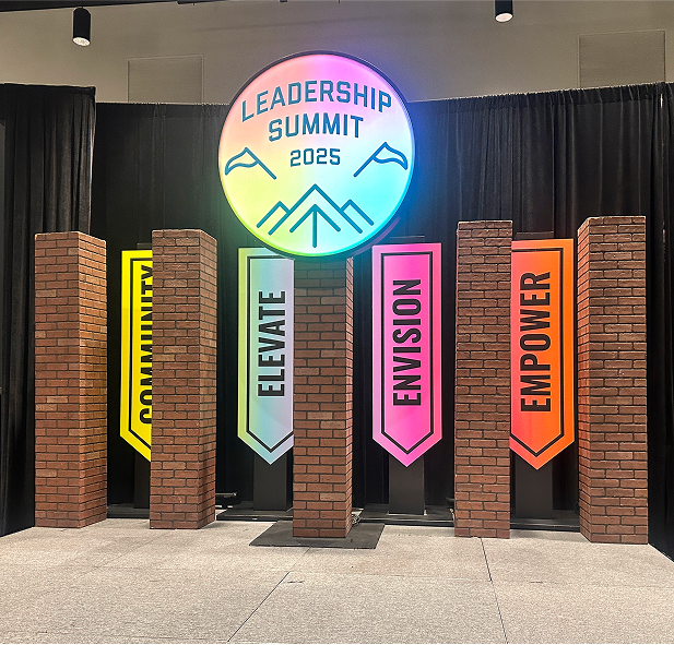 Graphic of a typography specimen showing the alphabet and numerals on top of a dark gray background.