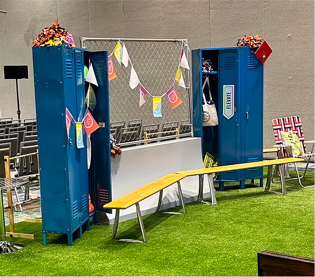 Graphic of a typography specimen showing the alphabet and numerals on top of a dark gray background.