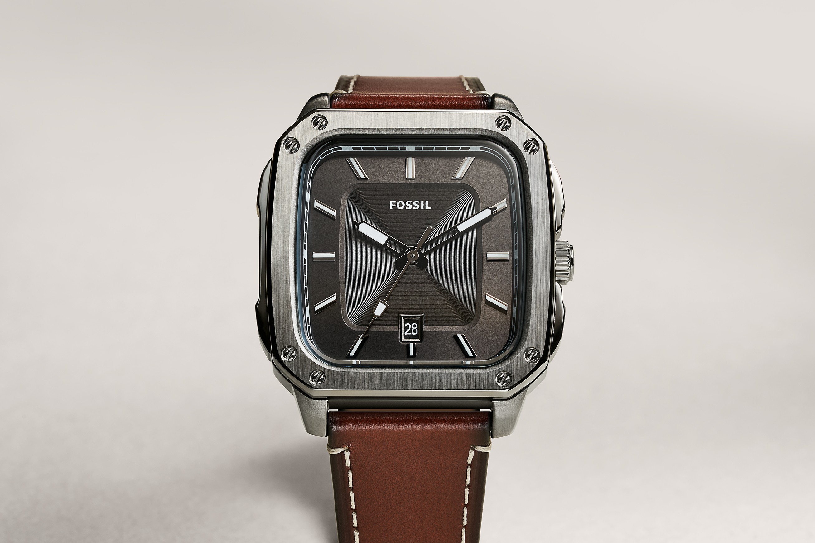 Graphic of a typography specimen showing the alphabet and numerals on top of a dark gray background.