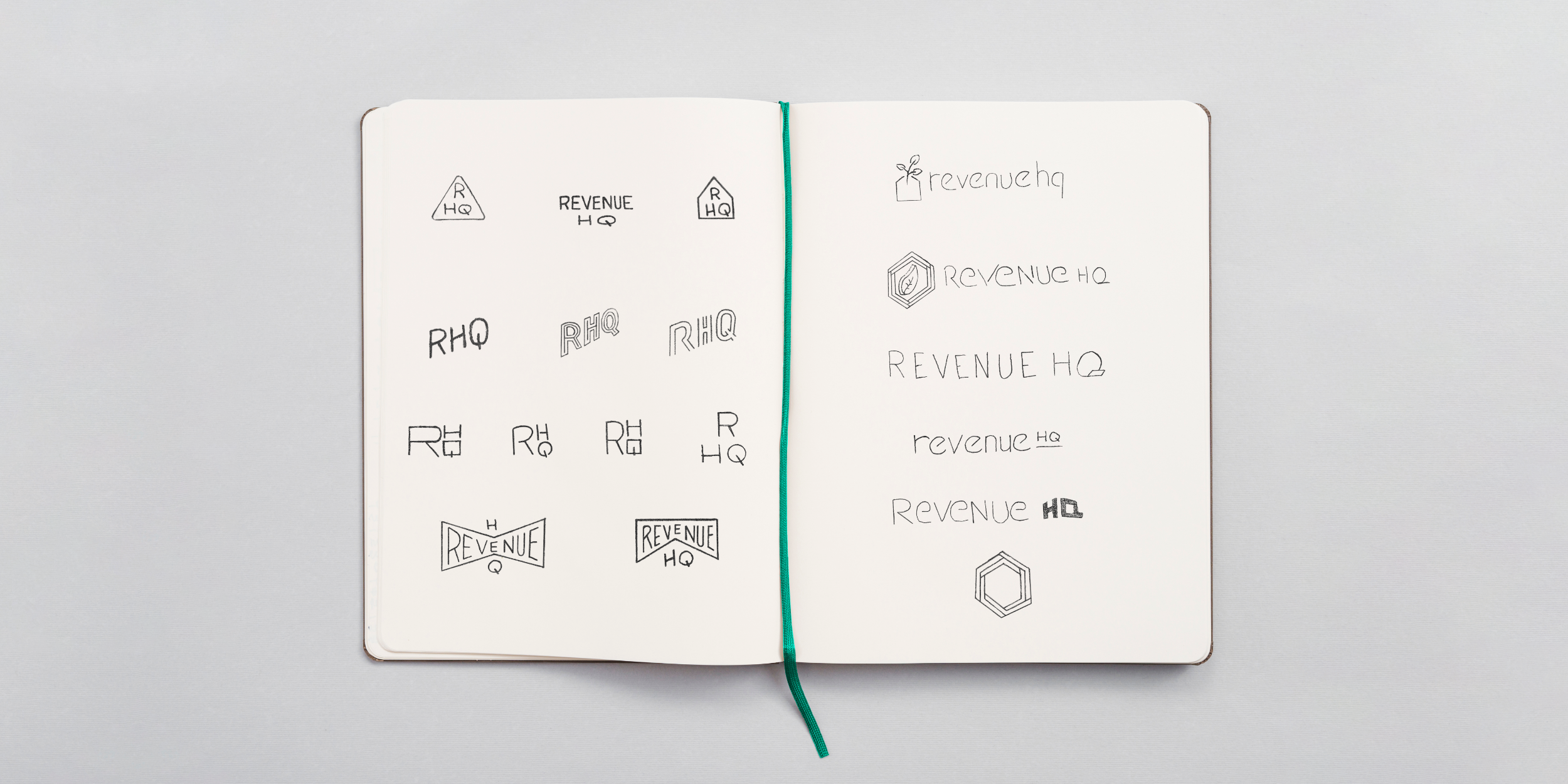 Revenue HQ logo sketches in a sketchbook