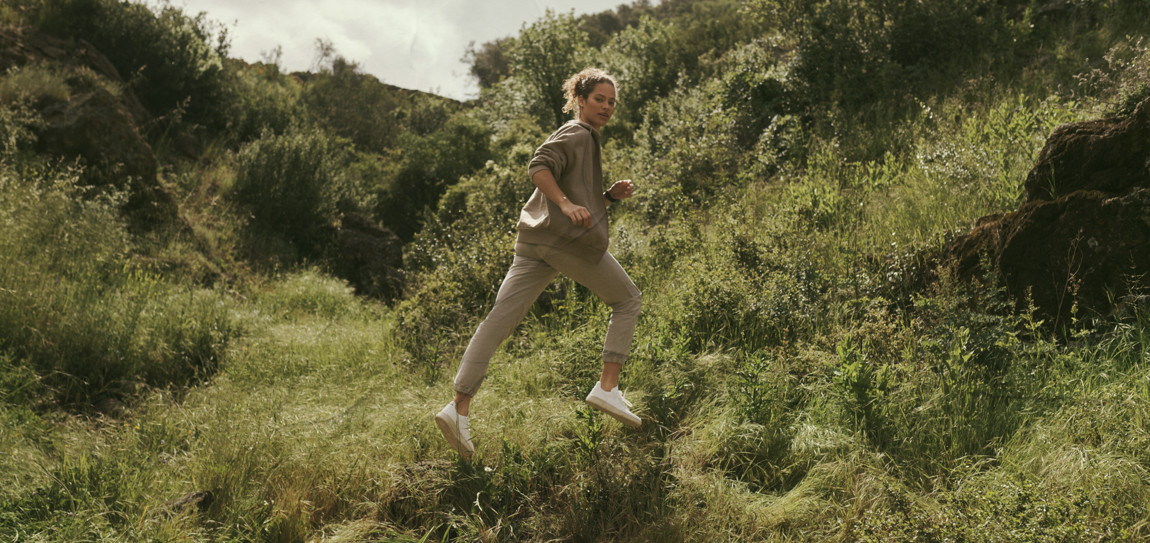 Anders brand wordmark in white placed on top of an image of a modern interior design.