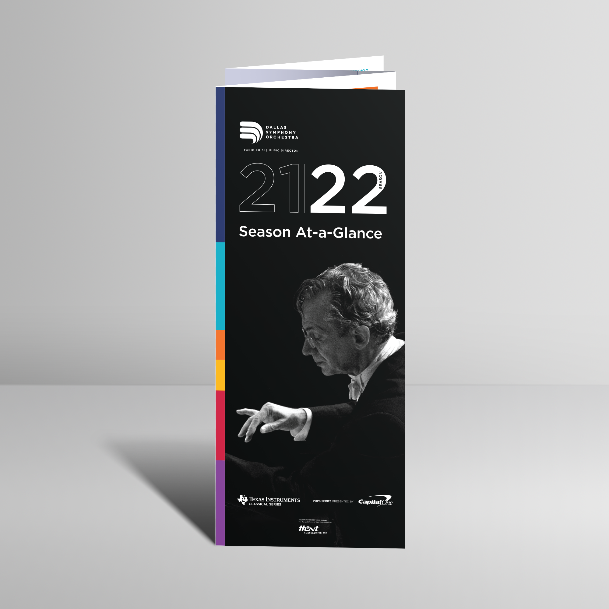 Image of Fossil x Lalaland yellow tin packaging on a mirror refelecting a bright blue sky with fluffy white clouds